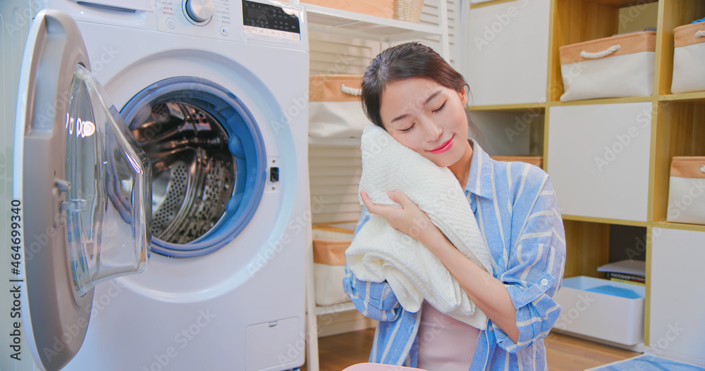 Asian housewife wash clothes