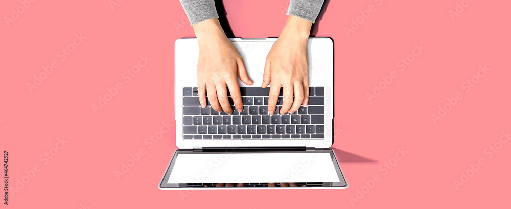 Person using a laptop computer from above