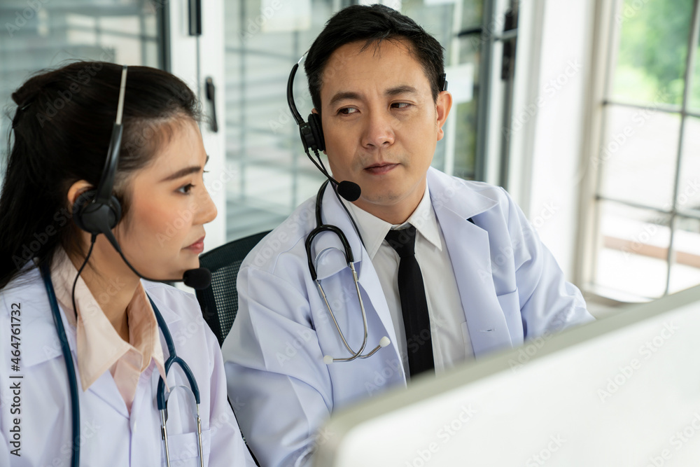 Doctor team wearing headset talking actively on video call in hospital clinic . Concept of telehealt