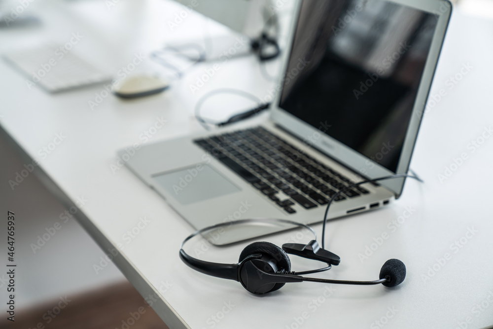 Headset and customer support equipment at call center ready for actively service . Corporate busines