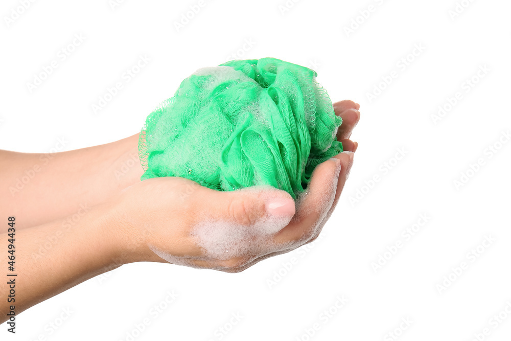 Woman holding green bath sponge with foam on white background, closeup