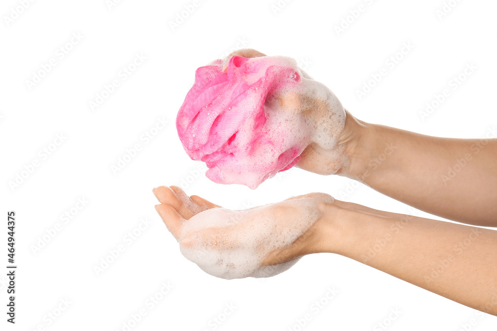 Woman holding pink bath sponge with foam against white background, closeup