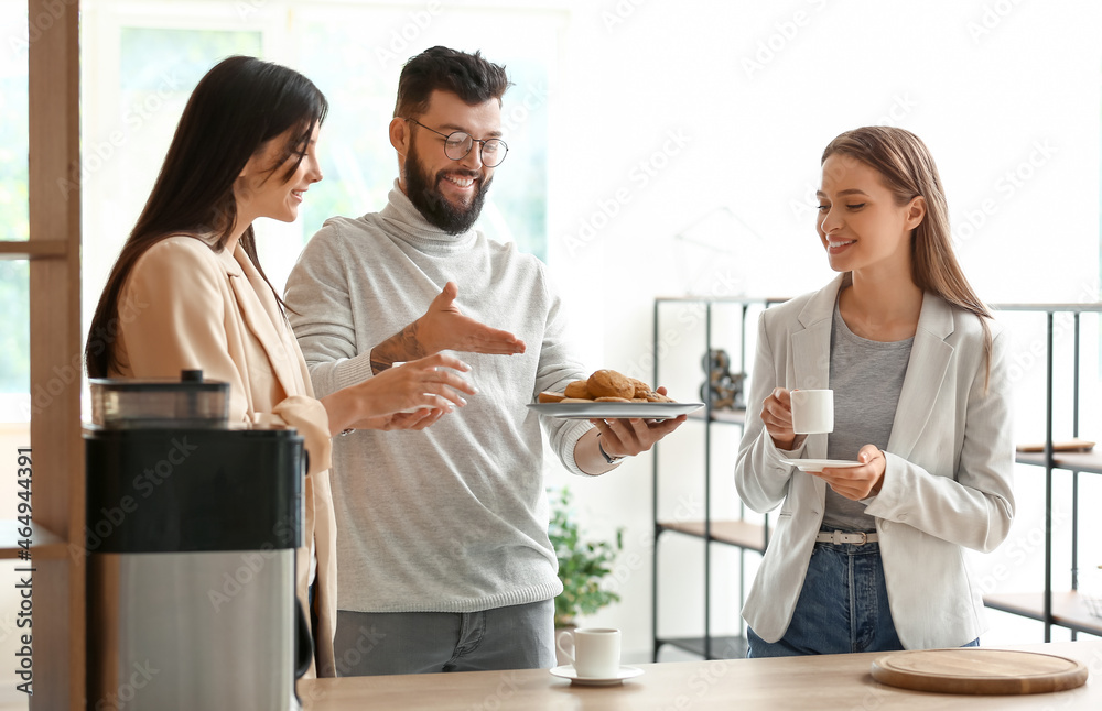 People having coffee break in office