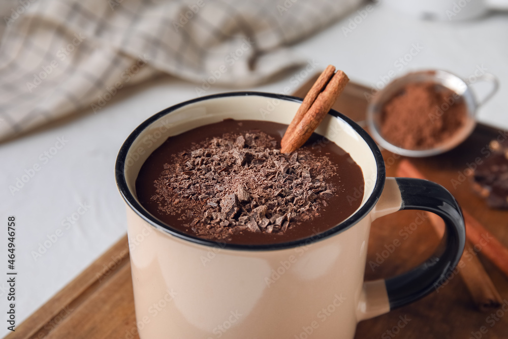 Mug of tasty hot chocolate on white background