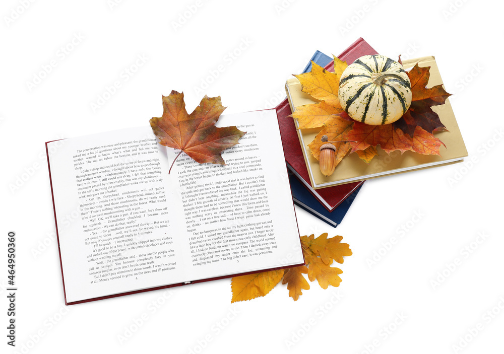 Books, autumn leaves and pumpkin on white background