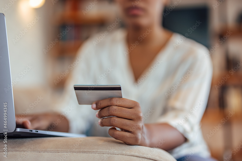 Adult woman, checking if her credit card still works.