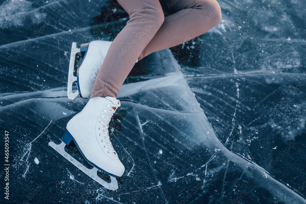 figure skates on ice top view. legs of a figure skater girl