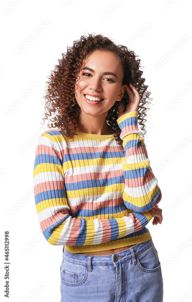 Young African-American woman with healthy hair on white background