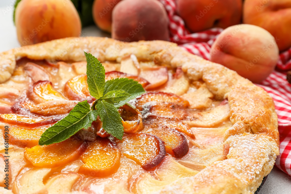 Tasty peach galette on table, closeup