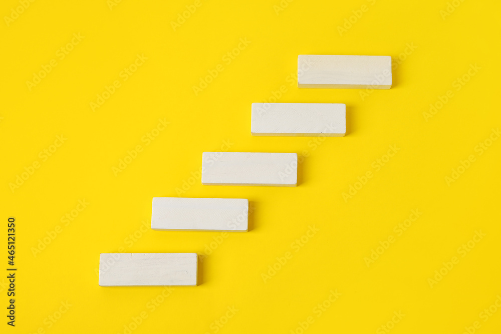 White blocks on yellow background