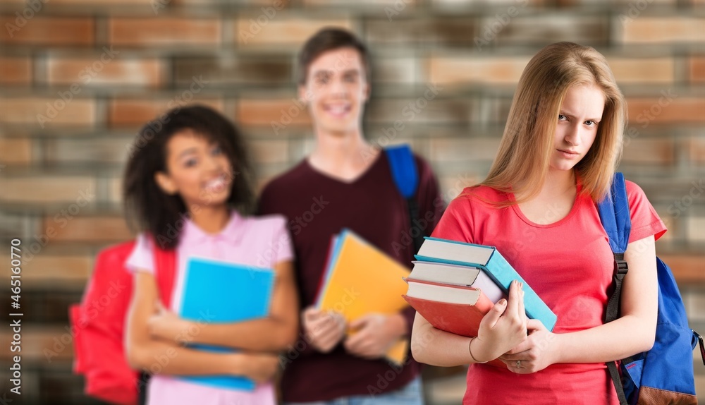 Cheerful young group of college students or friends laughing together