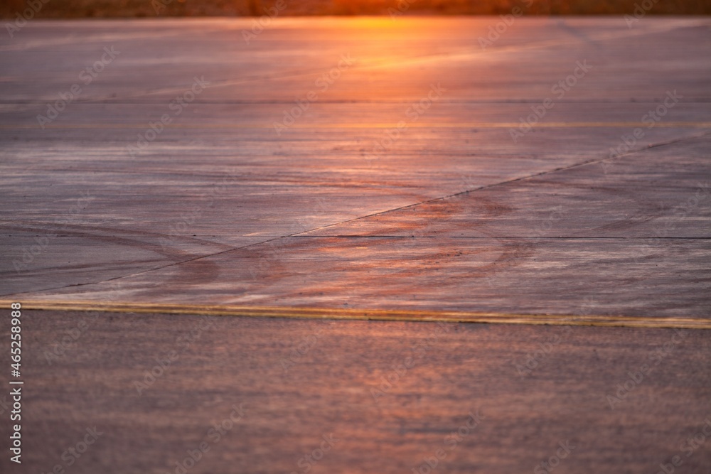 Asphalt race track and sunset light