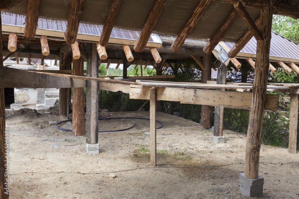 Building Attic Interior. Roofing Construction Indoor. Wooden Roof Frame House Construction.