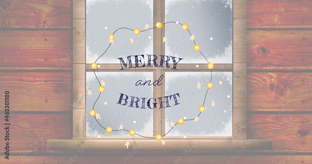 Composition of merry and bright text over christmas decorations and window