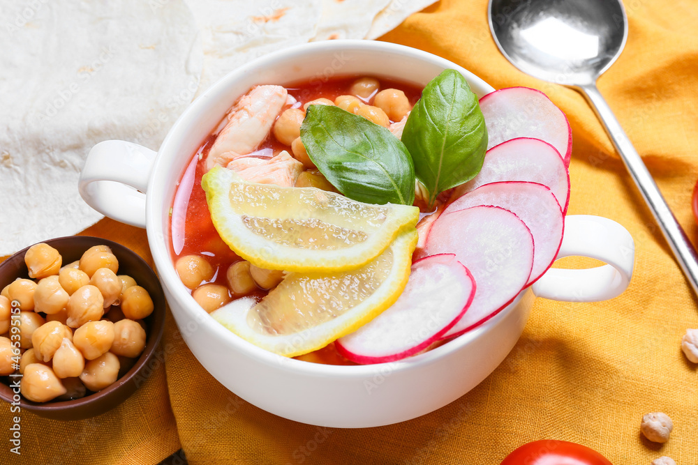 Pot with delicious pozole soup on table, closeup