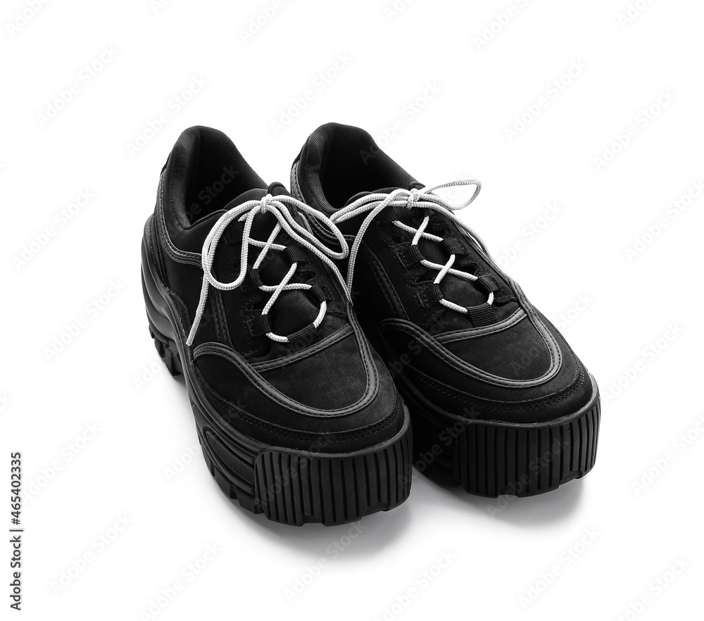 Black shoes with laces on white background