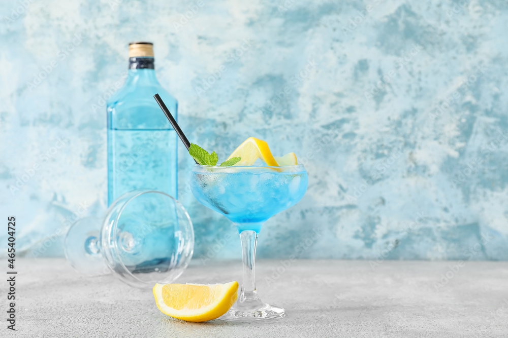 Glass of Blue Lagoon cocktail on table