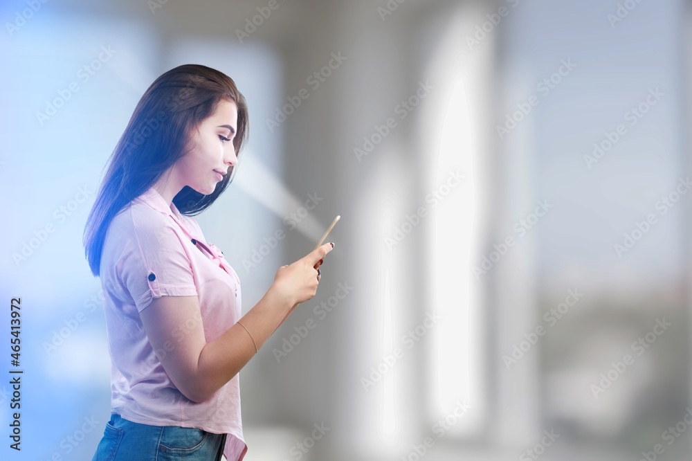 Businesswoman checking her personal data. Scanning her face by smart phone to unlock it.