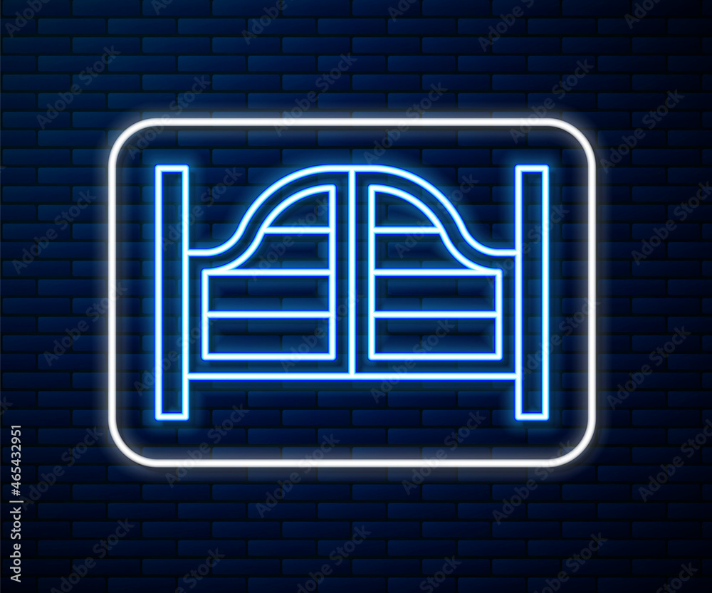 Glowing neon line Old western swinging saloon door icon isolated on brick wall background. Vector