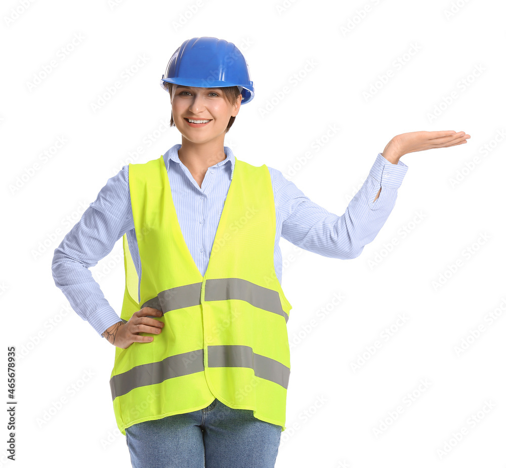 Female construction worker in hardhat showing something on white background