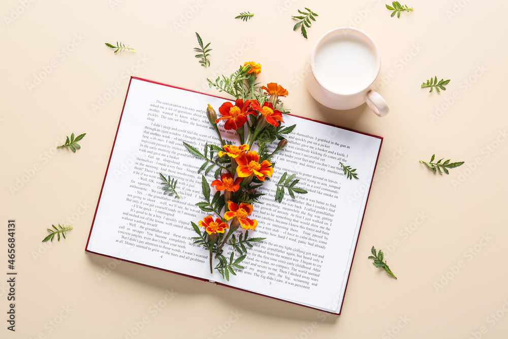 Composition with book, cup of milk and marigold flowers on color background