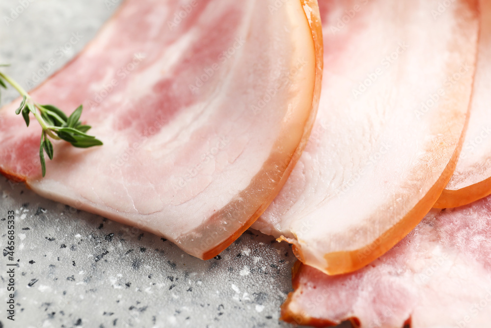 Slices of smoked bacon on table, closeup