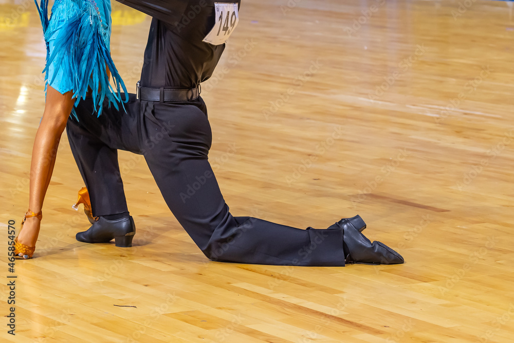 Woman and man dancing latin program. International competition.