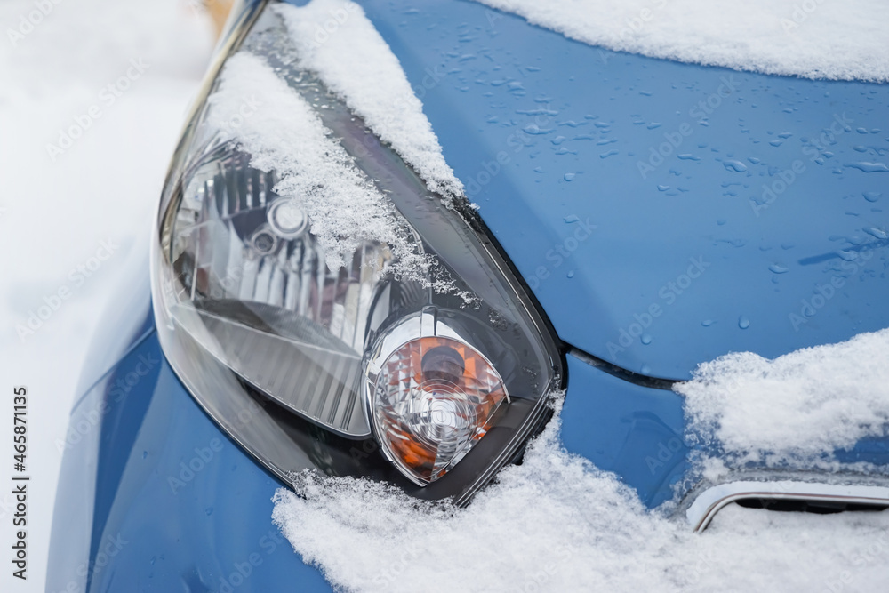 Modern car on snowy day, closeup