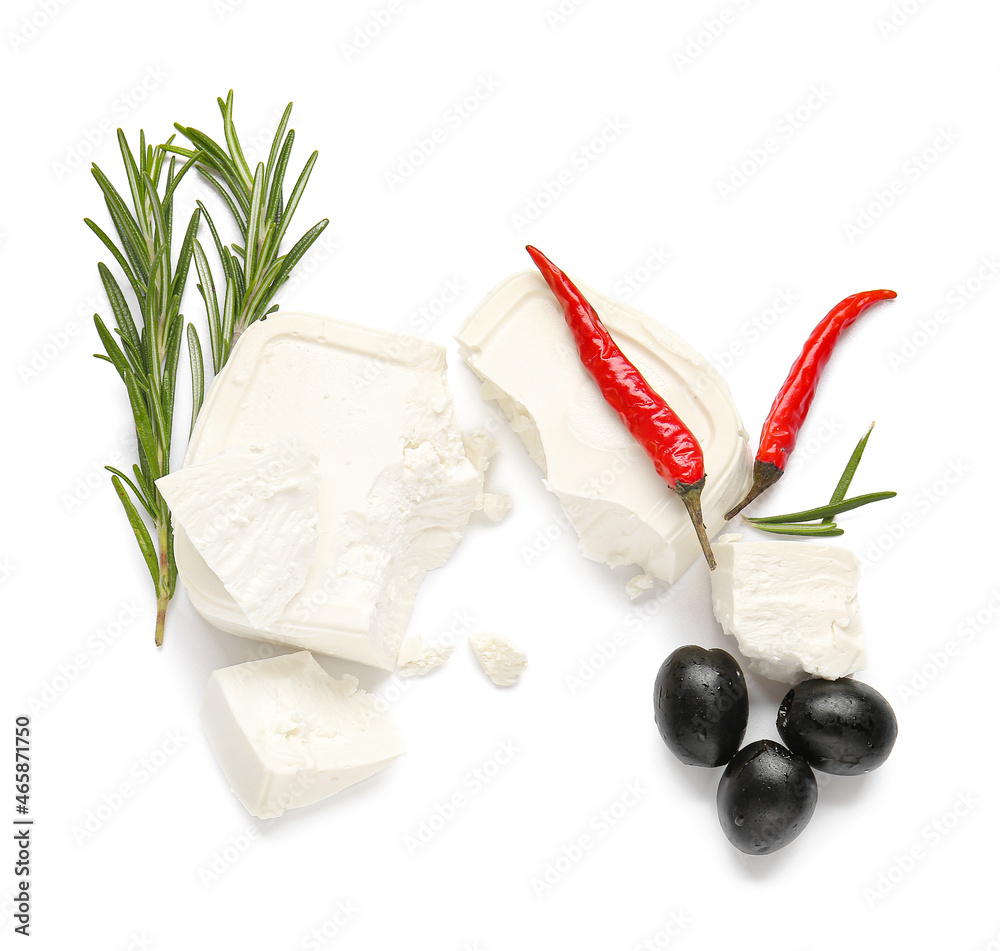 Feta cheese, chili peppers and olives on white background