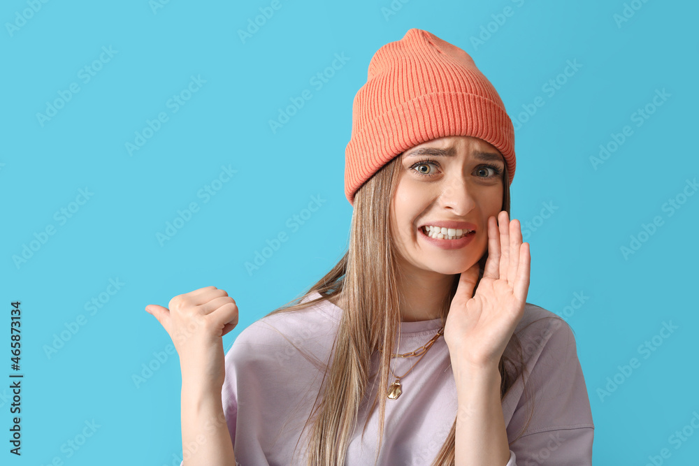 Gossiping woman on color background