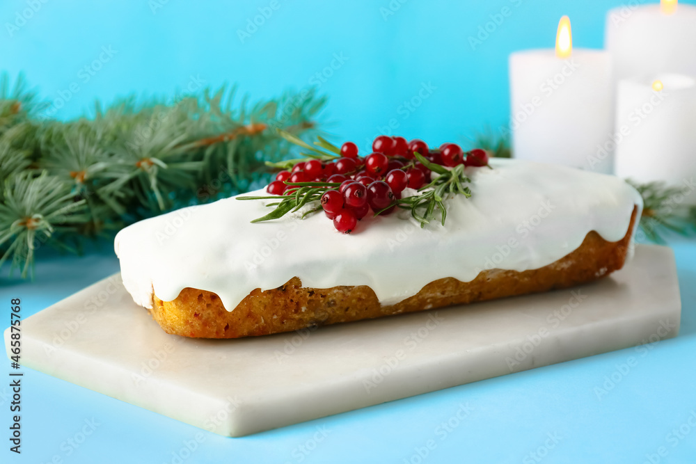 Board with tasty Christmas bread on color background