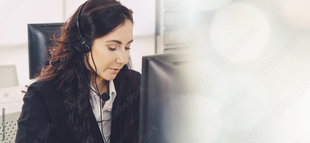 Business people wearing headset working in office to support remote customer or colleague. Call cent