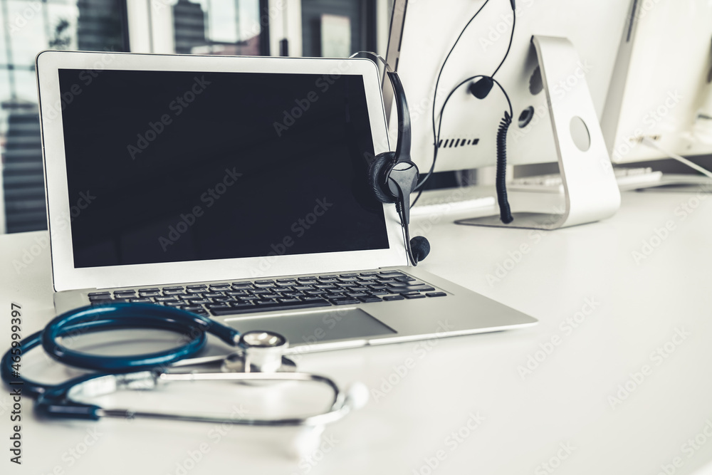 Headset and doctor equipment at clinic ready for actively support for patient by online video call .