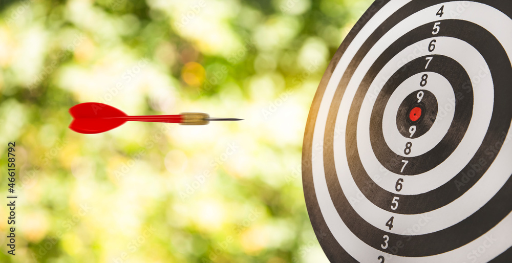 New Target and goal as concept, Close up shot of the dart arrow hit on bullseye, red dart arrow hitt