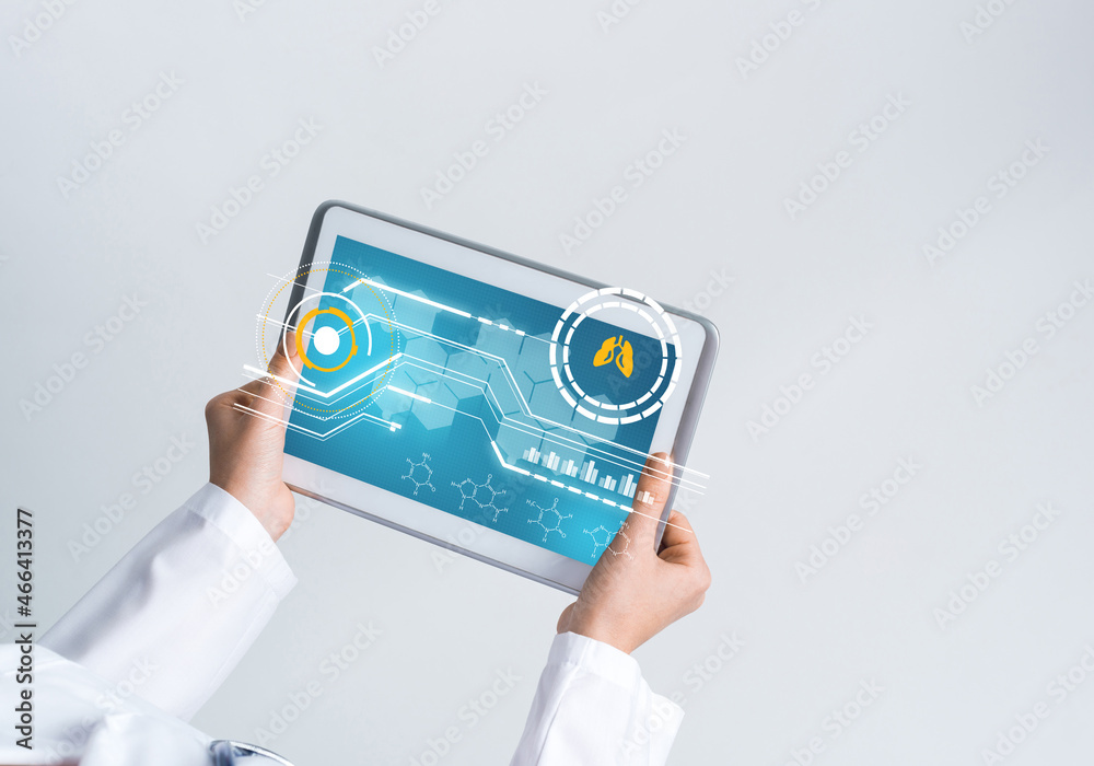 Close of female doctor hands working with tablet pc computer