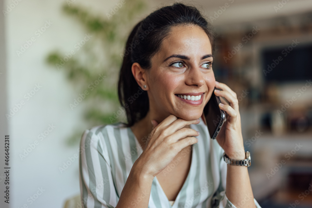 Optimistic adult woman, having a pleasant conversation