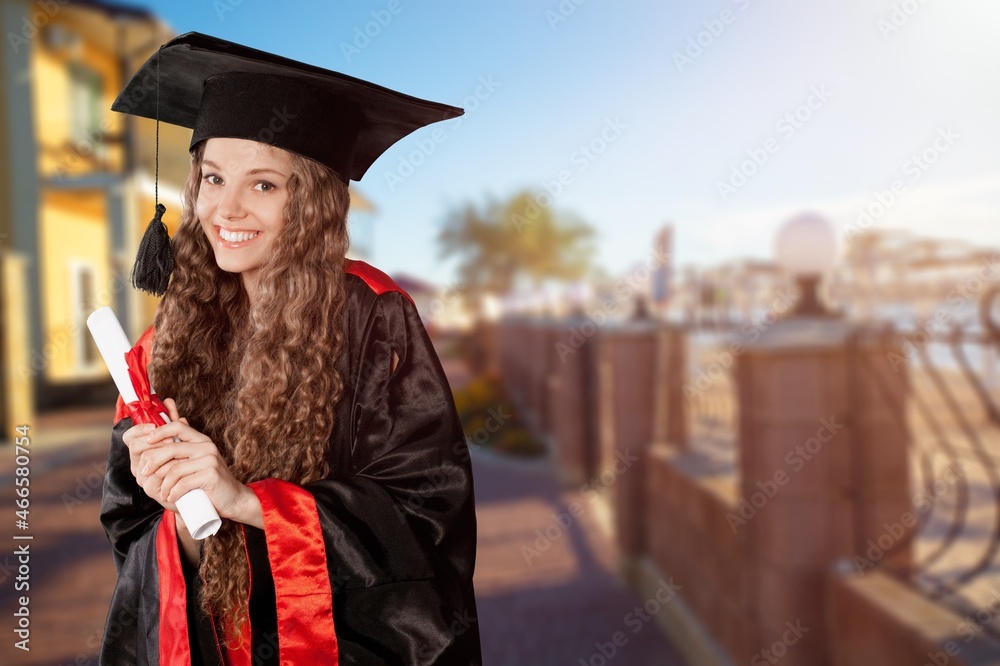 Happy smart student with graduation certificate.