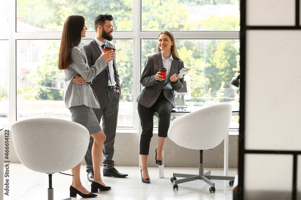 Business people having coffee break in office