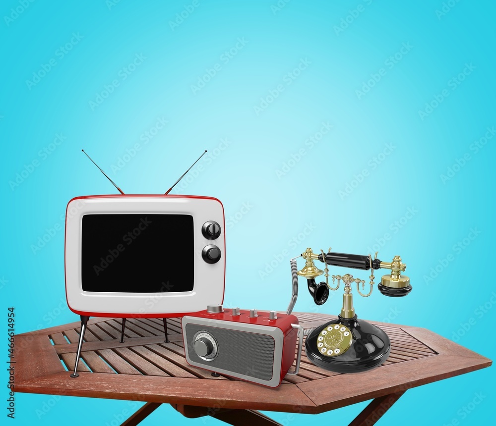 Retro outdated TV set and classic telephone on a table