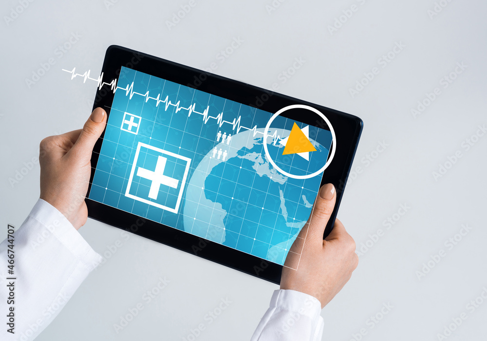 Close of female doctor hands working with tablet pc computer