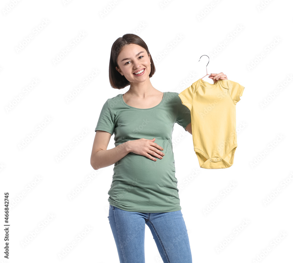 Young pregnant woman with baby bodysuit on white background