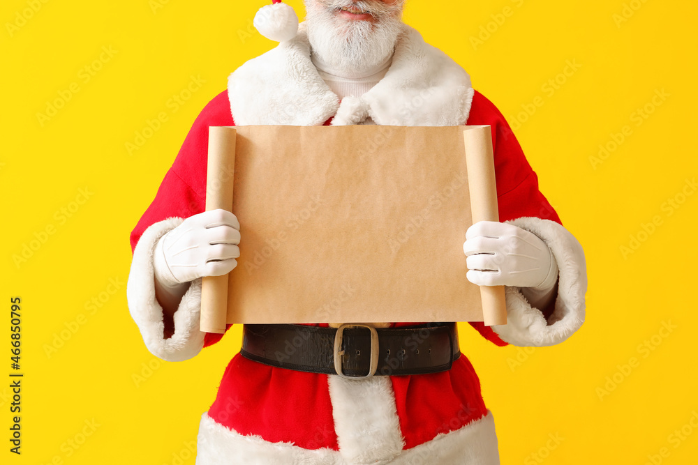 Santa Claus with blank letter on color background