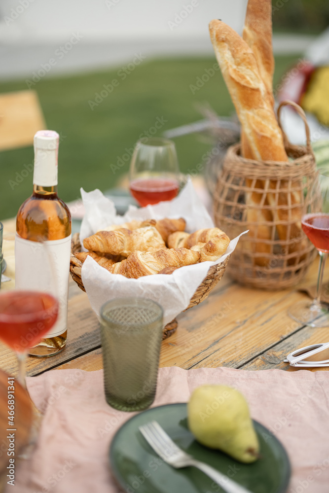 Picnic wooden table with wine, fresh organic fruits and bread. Concept of holiday and leisure. Healt