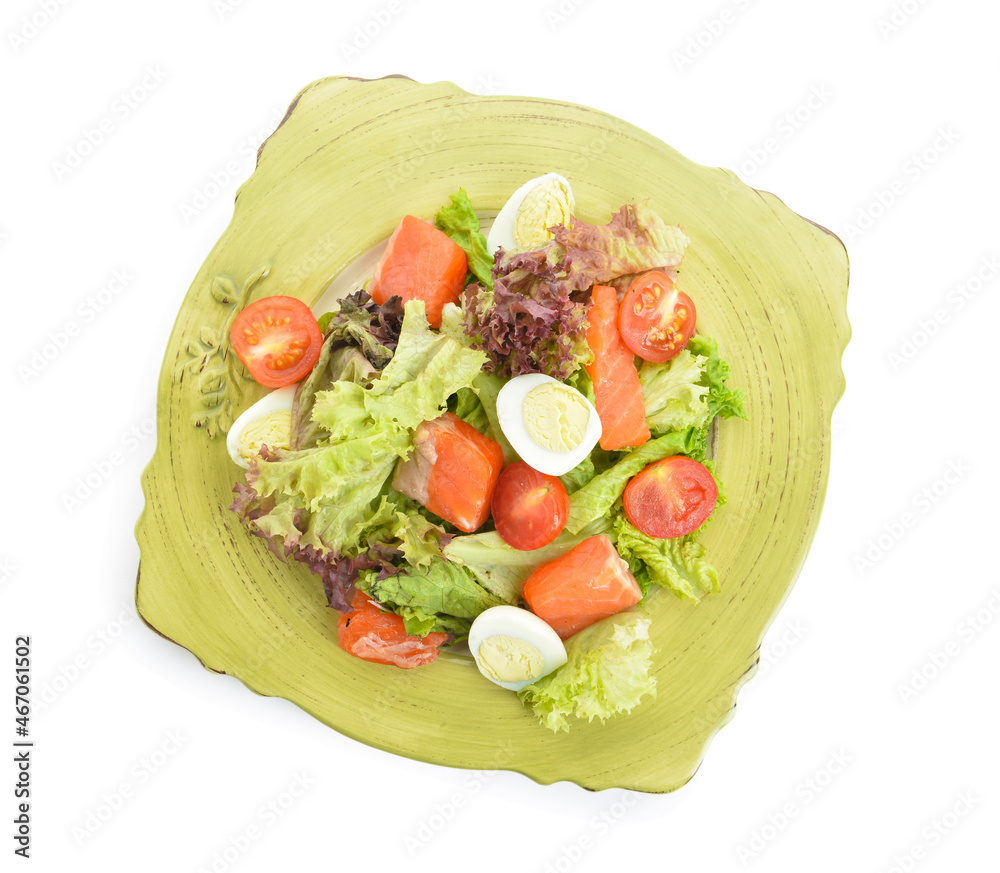 Tasty salad with salmon and fresh vegetables in plate on white background