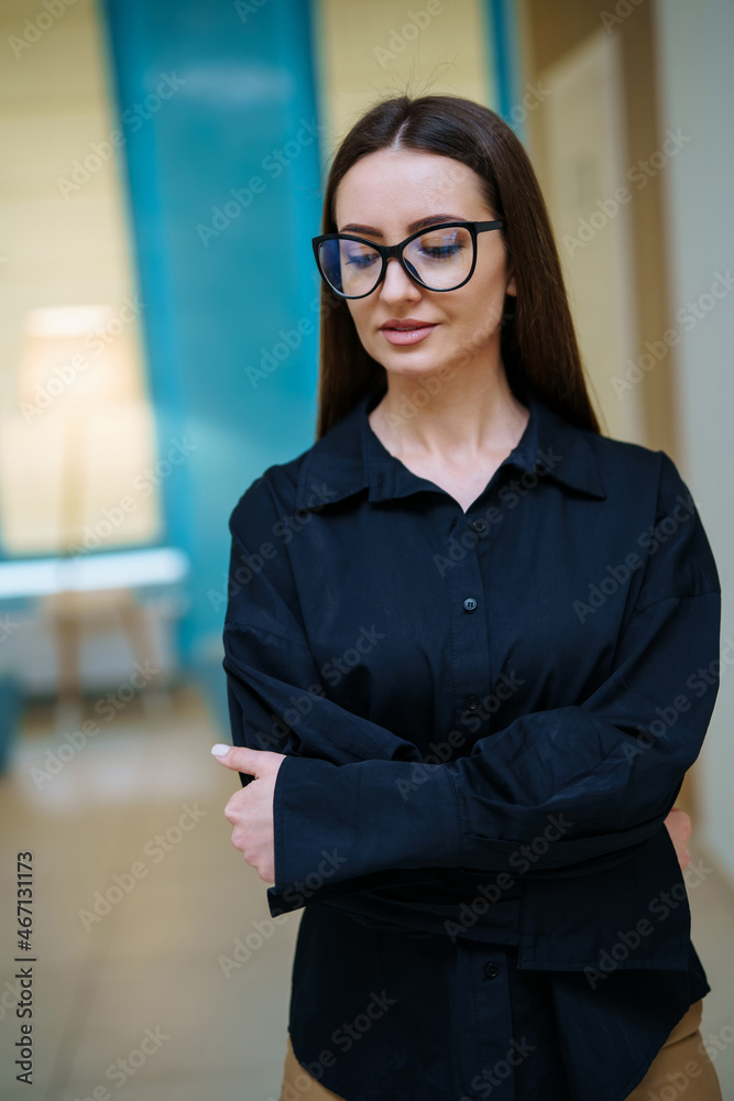 Client in clinic in new spectacles. Woman in glasses with diopters after new prescription looking do