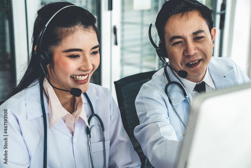 Doctor team wearing headset talking actively on video call in hospital clinic . Concept of telehealt