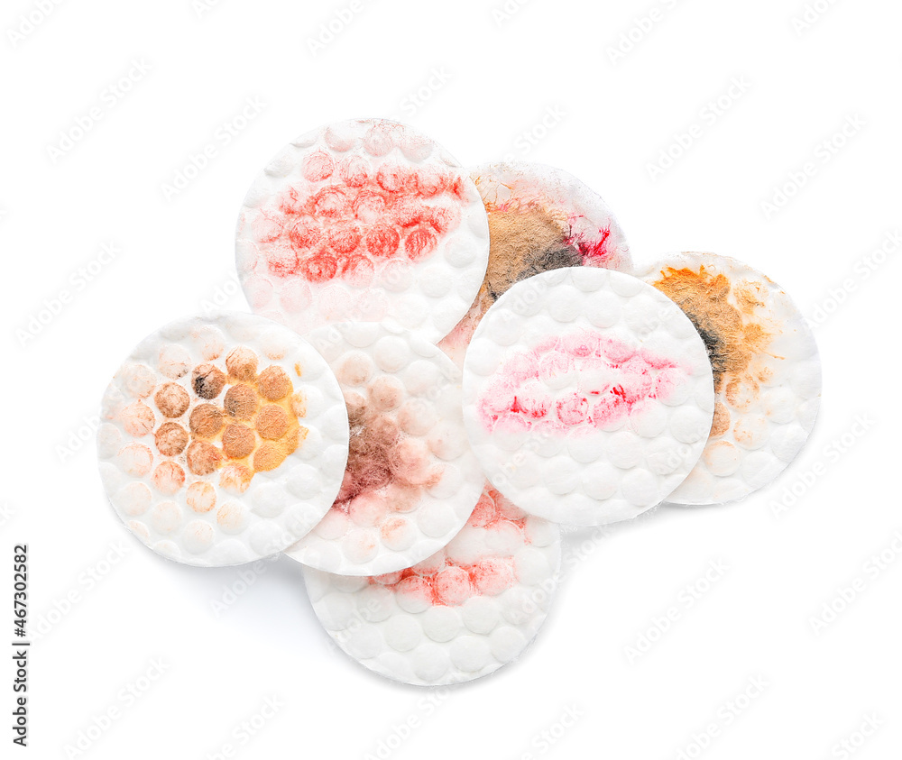 Dirty cotton pads on white background