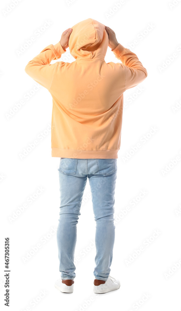 Young guy in stylish hoodie on white background, back view