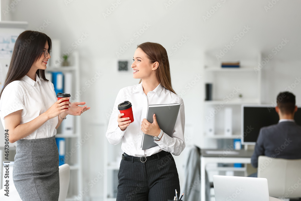 Business people having coffee break in office