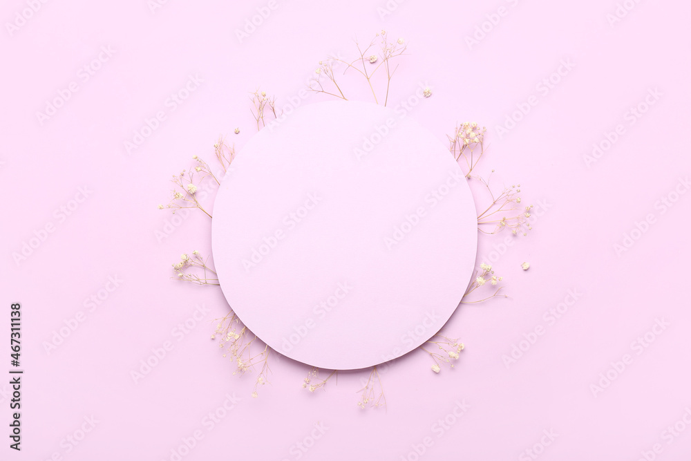 Blank card with dried flowers on lilac background